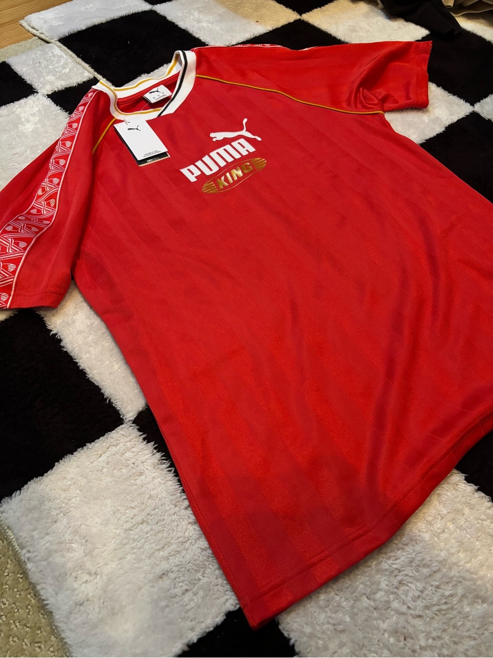 Puma Red Soccer Jersey with White Logo and Gold Trim